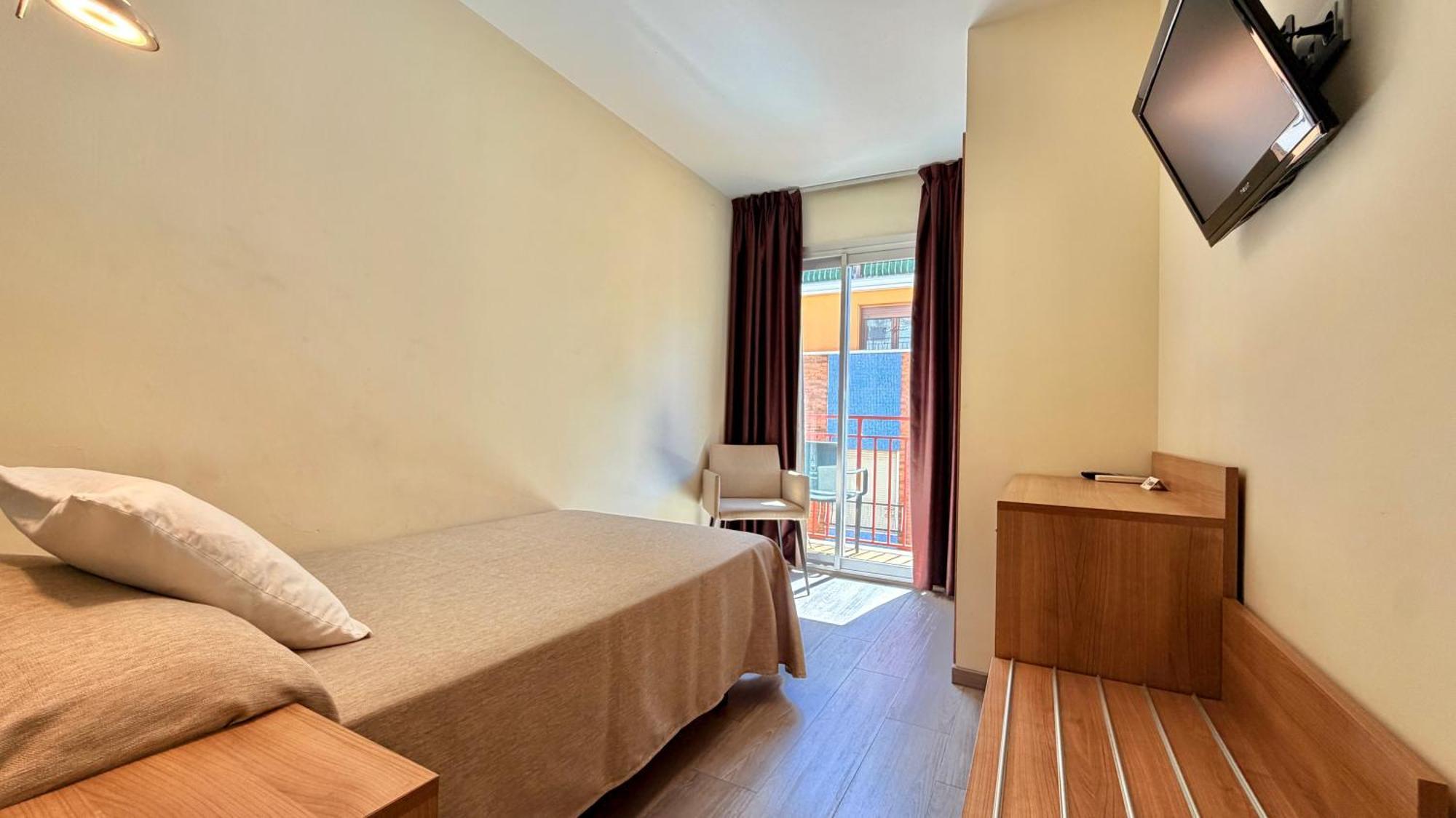 Quarto Individual com Varanda